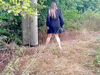 Girl peeing in public in the woods