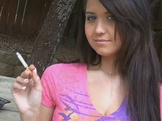 Holding a cigarette with an increment of teasing her friend